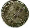 Anverso de moneda de 8 reales (plata) de Carlos IV de 1789 con resello de Singapur.
