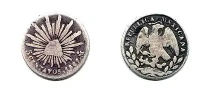Moneda mostrando su anverso y reverso.