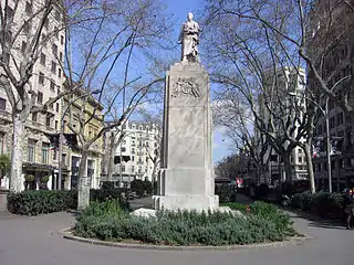 A Joan Güell i Ferrer (1888), de Joan Martorell y Rossend Nobas, Gran Vía de las Cortes Catalanas con Rambla de Cataluña.