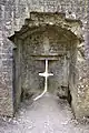 Aspillera en cruz, en el castillo Corfe.