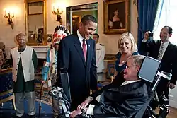 Barack Obama talking to Stehen Hawking in the White House