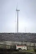 Ermita de Sotobrín. Al fondo aerogenerador.