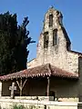 El pórtico y campanario de la capilla de San Blas