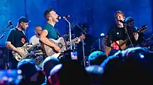 Coldplay performing with Ed Sheeran in 2021.