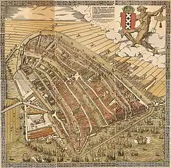 Una vista de pájaro de Ámsterdam alrededor de 1544, mirando hacia el sur. Damrak es el canal en el centro.