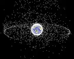 La Tierra desde el espacio, rodeada de pequeños puntos blancos