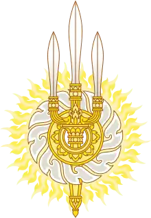 Emblema de la dinastía Chakri, la casa real de Tailandia fundada en 1782. El emblema de la dinastía consiste en la trishula entrelazada con el Sudarshana Chakra, otra arma, para crear un Chakri.