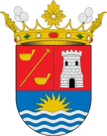 En el escudo de Adeje figura a la izquierda de la torre: de gules, una añepa puesta en barra acompañada de dos gánigos, todo de oro.