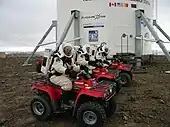 Robert Zubrin, Vladimir Pletser, and Katy Quinn of Crew 2 prepare to begin a motorized EVA on July 15, 2001.