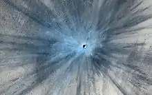 Fresh crater on Mars showing a ray system of ejecta