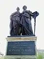 Helvetia (a la derecha) junto a "Ginebra" (monumento en Ginebra).
