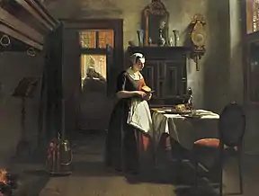 Chica de orfanato en Amsterdam preparando la cena.