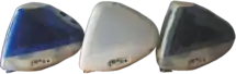 Side view arrangement of dark blue, grey, and white iMacs.