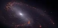 Una versión en "falso color" de Messier 66 sacada por el Telescopio Espacial James Webb