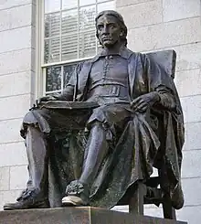 Bronze statue of a seated man