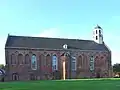 Iglesia claustral de Ten Boer en la transición del románico al gótico.