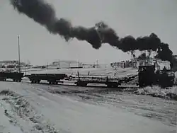 Tren carguero con estrecha relación con el Almacén.