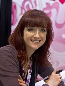 Lauren Faust smiling towards the camera at the 2012 WonderCon