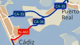 La N-443 se proyectó con un carril para cada sentido. En la actualidad tiene además un carril reversible. Cuenta con una zona central móvil para el paso de buques hacia la base de Carraca y los astilleros de San Fernando