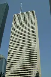 Fifty-floor, rectangular skyscraper with rows of identical windows and minimal ornamentation.