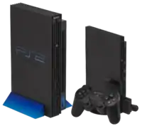 Slimline (right) and Original (left) PS2 consoles