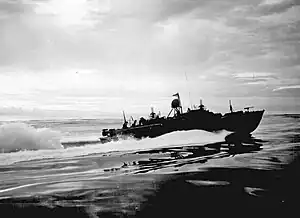 Silhouette of a boat moving at speed across the water.