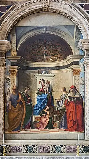  Oil painting. A large altarpiece in which the Madonna sits on a raised throne, with four saints and an angel as described in the article.