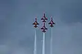 Cuatro F-5E de la Patrouille Suisse volando en formación.