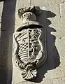 Escudo de la casa vecina medianera