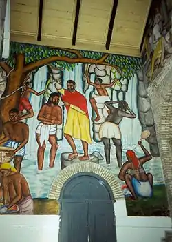 Mural del bautismo de Jesús en una iglesia rural haitiana, Catedral de la Trinidad, Puerto Príncipe, Haití.