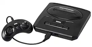 Una consola Sega Mega Drive Modelo 2 y su mando.