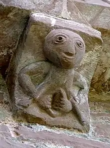 Sheela na Gig at Kilpeck, England, 12th century