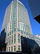 12 Metrotech Center, a high-rise clad in a façade of stone and limestone, viewed from street level