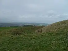 Rampart, ditch and bank of the Trundle Iron Age hillfort