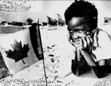 Turks and Caicos Islander and Canadian Flag.png