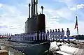 La tripulación del USS Minnesota maneja el barco durante su puesta en marcha en la Base Naval de Norfolk el 7 de septiembre de 2013.