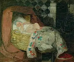 Interior con bebé en un moisés.