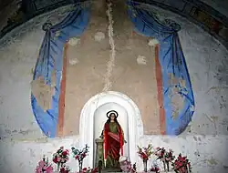 Detalle del retablo de pincel en el altar mayor de la iglesia parroquial de Arroyo Cerezo, Castielfabib (Valencia).