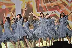 Members of Nogizaka46 performing on stage