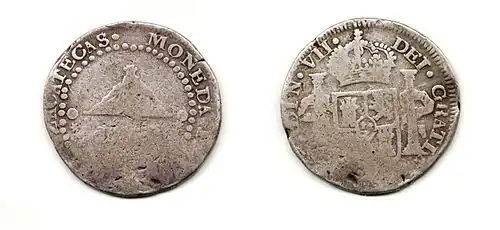 Moneda de dos reales de Fernando VII, Zacatecas, 1811 (en el anverso, el perfil del Cerro de la Bufa).