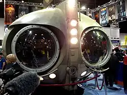 A ship resembling an owl, with two large eye-like windows and flashlights across the "nose"