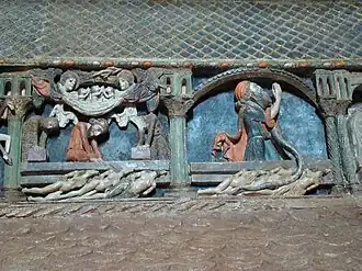 En la primera escena se ve a dos ángeles que portan sus almas al cielo. La segunda escena muestra el castigo del judío por medio de una serpiente.