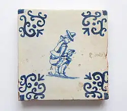 Un recurrente motivo escatológico en el Flandes del siglo XVII, muy popular en la serie del azulejo de oficios de larga tradición en Cataluña.