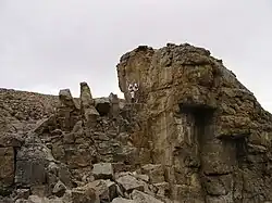 Markus Landgraf of Crew 7 uses a geologist hammer to obtain rock samples during EVA.