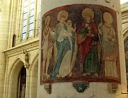 Fresco de comienzos del siglo XVI (de izquierda a derecha: Juan Bautista, Santa María con el niño Jesús, San Juan Evangelista, San Didier sosteniendo su cabeza decapitada). Se ve un pasaje de Champagne en el pilar lateral en alto a la izquierda.