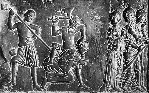 Representación medieval de los prusianos matando a San Adalberto, obispo misionero; parte de las Puertas de Gniezno, c. 1175.