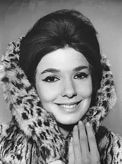 Graciela Borges, Argentine fashion icon of the 1960s, wearing a fur coat, bouffant hair and winged eye liner.