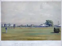 Ground of the Calcutta Cricket Club, 15th Jan'y. 1861 H.M. 68th L.I. from Rangoon, versus the Calcutta Cricket Club, una litografía sobre una acuarela de Percy Carpenter, que muestra el Club de Cricket de Calcuta, con el Maidan al fondo.