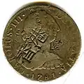 Anverso de moneda de 8 reales (plata) de Carlos III de 1781 resellada en Hong Kong.