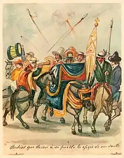 Indios que llevan á su pueblo la efigie de un santo